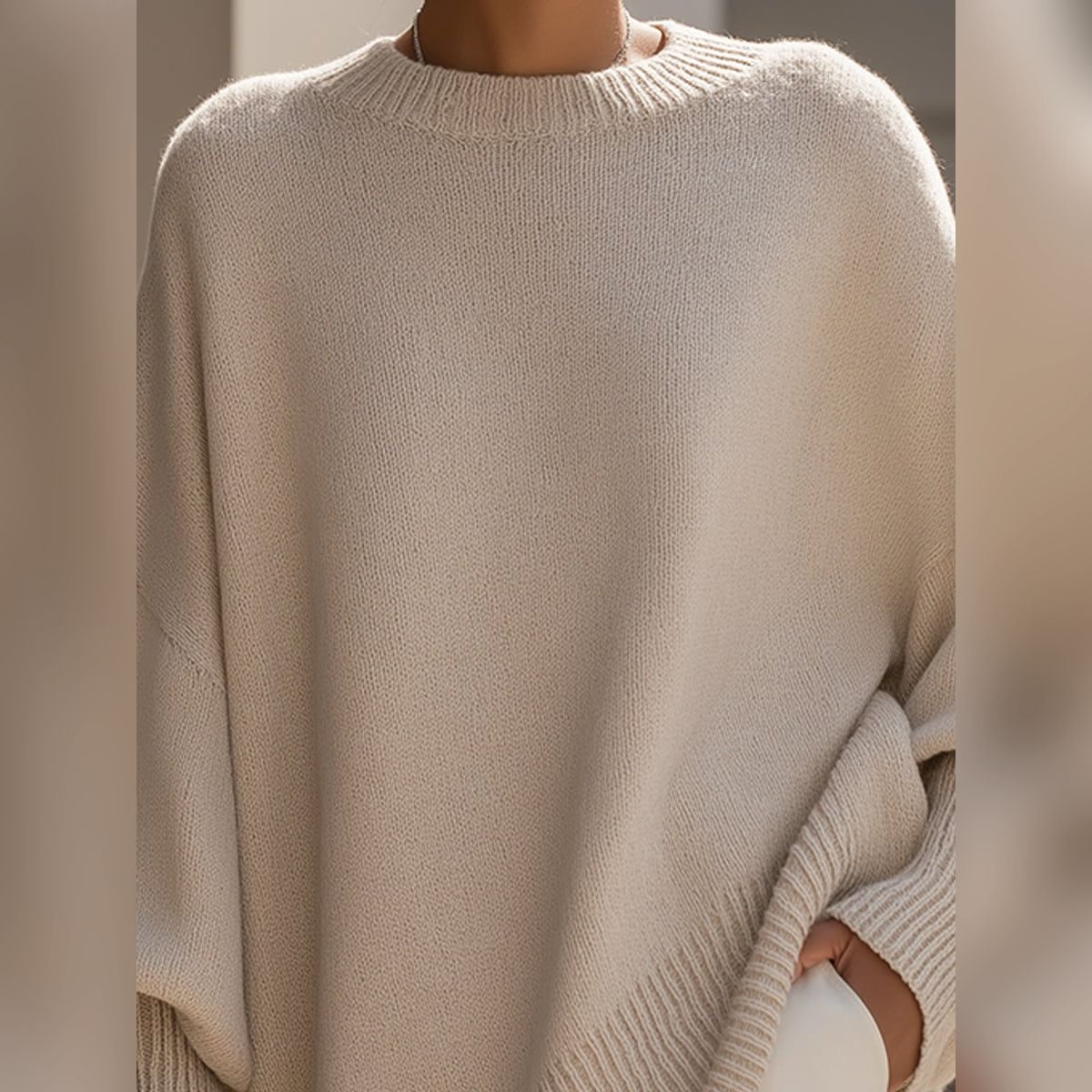 women's oversized asymmetrical hem sweater in beige