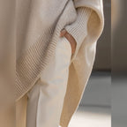 women's oversized asymmetrical hem sweater in beige