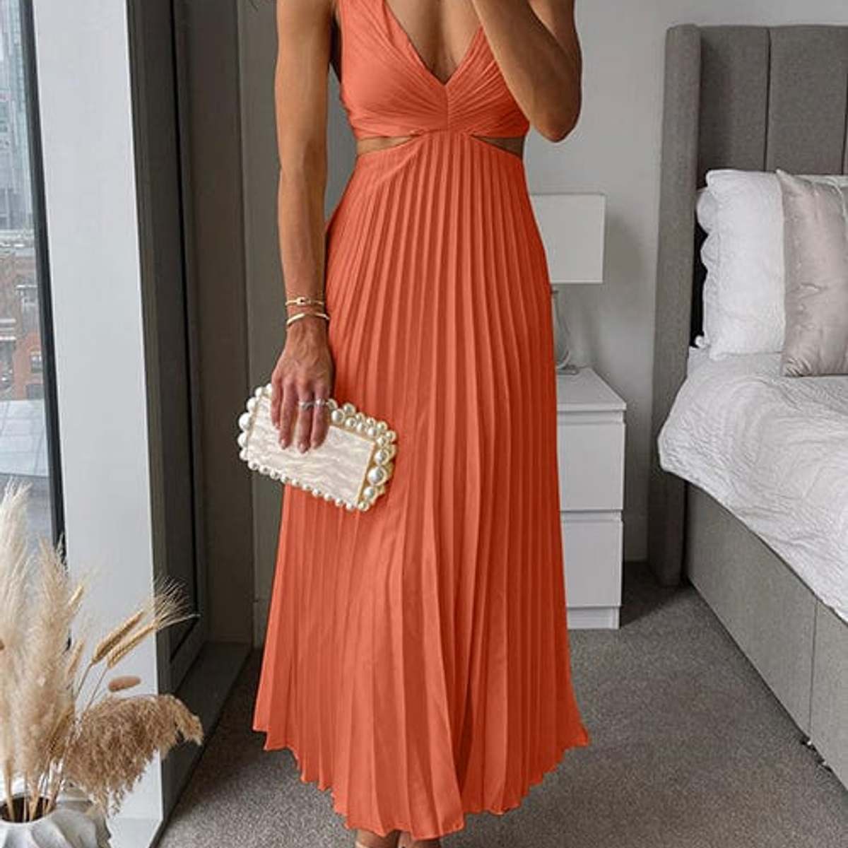 women's pleated midi dress in orange