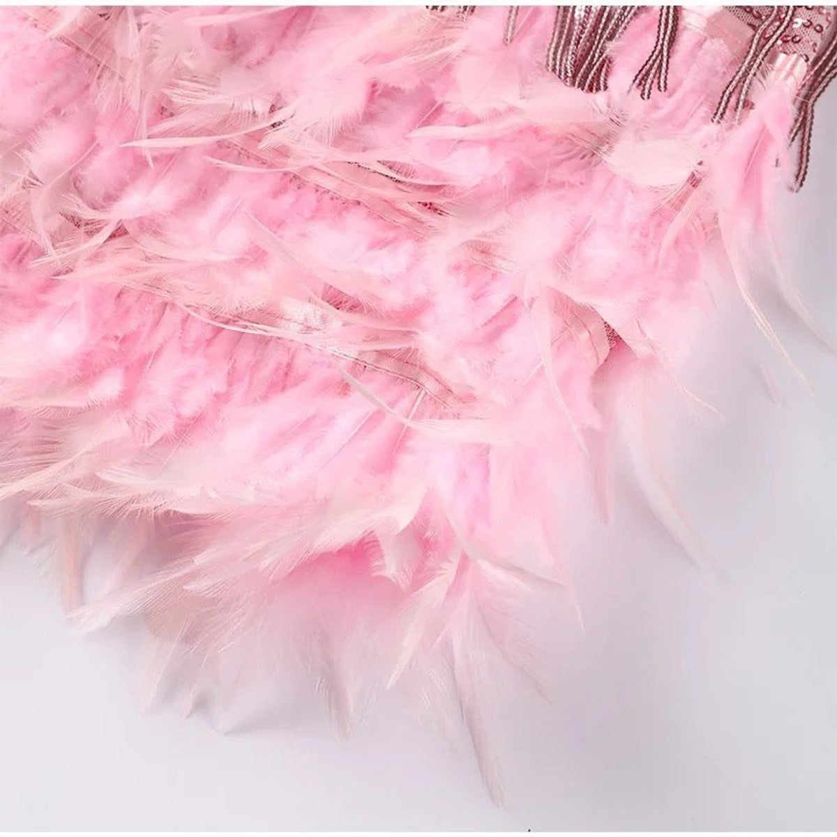 women's sequin cocktail dress with feather hem in pink